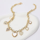 14K gold plated station necklace featuring sparkling CZ paved heart charms and mother of pearl heart accents on a chunky chain on a white background