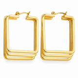 Gold triple square hoop earrings with geometric layered stainless steel design and polished finish on a white background.
