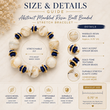 An infographic detailing the size and features of an abstract marbled resin ball beaded stretch bracelet. The graphic shows a circular arrangement of the cream and navy blue beads with gold spacer accents, accompanied by text callouts describing the stretchable fit, material, and specifications.