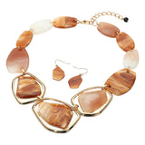 Chunky geometric caramel brown swirled acetate plate statement necklace and earring set on white background