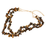 Tiger eye natural stone chip double layered statement necklace with 18K gold dipped accents on white background