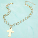 18K gold dipped chunky cross pendant necklace with oval link chain on a light blue background