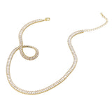 Gold necklace with clear gemstones on a white background