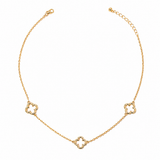 Genuine gold dipped open quatrefoil station necklace with three delicate clover stations on an adjustable hypoallergenic chain.