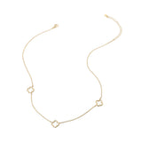 Genuine gold dipped open quatrefoil station necklace with three delicate clover stations on an adjustable hypoallergenic chain.