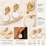 Gold geometric drop earrings featuring polished organic gold-tone studs with white marbled resin dangle accents on a beige background.