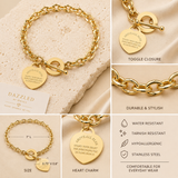 A gold-toned chain bracelet with a toggle clasp and a heart-shaped charm engraved with 'Above all else, guard your heart, for everything you do flows from it.', shown in a multi-panel product collage with close-ups, size measurements, and feature callouts.