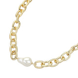 Chunky gold cable chain necklace with baroque simulated pearl accent close up on white background