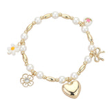 Gold pearl beaded stretch bracelet with heart, bow, flower, and ceramic charm accents