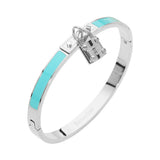 Turquoise enamel hinged bangle bracelet with silver-tone stainless steel finish and lock charm accent on a white background