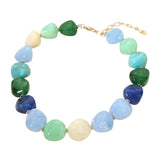 Chunky marbled resin pebble bead statement necklace in ocean blue colorblock on white background