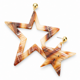 A pair of star-shaped drop earrings with a marbled brown, orange, and cream resin pattern, featuring gold-tone ball studs on a white background.