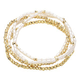 Five-piece pearl and gold beaded stretch bracelet set featuring layered stackable designs with elegant pearl-inspired accents on a white background