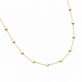 A delicate gold chain necklace featuring small, evenly spaced flat square beads on a plain white background.