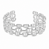 A wide silver cuff bracelet featuring a double-row interlocking link chain design, photographed on a clean white background.