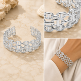 A silver chain-link cuff bracelet shown in three views: a wide product shot on a beige surface, a close-up of the chain links, and the bracelet worn on a wrist.