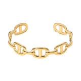 SECRET BOX stainless steel mariner link cuff bracelet in yellow gold tone. A polished gold-tone chain link cuff bracelet with a modern interlocking link design, shown on a plain white background.