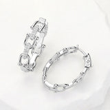Silver CZ hardware link huggie hoop earrings with sparkling pave accents and modern chain-inspired design.