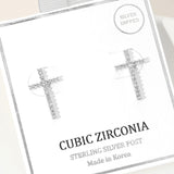 Silver CZ pave cross stud earrings with sparkling cubic zirconia stones and sterling silver posts.