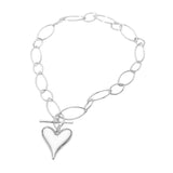 Silver chain bracelet with a heart-shaped charm on a white background