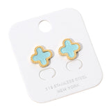 Gold stainless steel quatrefoil stud earrings with glossy turquoise stone center on white background.