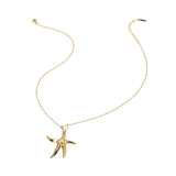 Gold starfish pendant necklace on a white background