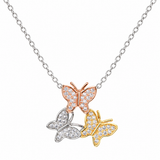 A silver chain necklace featuring three butterfly pendants in rose gold, yellow gold, and silver, each pavé-set with clear stones, shown against a plain white background.