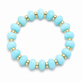 Turquoise resin stretch bracelet featuring polished round beads and gold spacer accents. Lightweight, comfortable, and perfect for everyday layering and gifting.