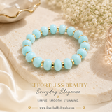 Turquoise resin stretch bracelet featuring polished round beads and gold spacer accents. Lightweight, comfortable, and perfect for everyday layering and gifting.