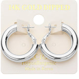 White gold dipped chunky tube hoop earrings with polished silver finish and hypoallergenic omega back closure.